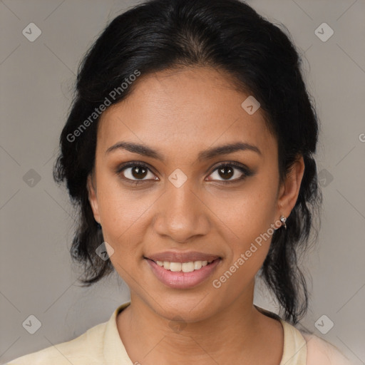 Joyful latino young-adult female with medium  brown hair and brown eyes