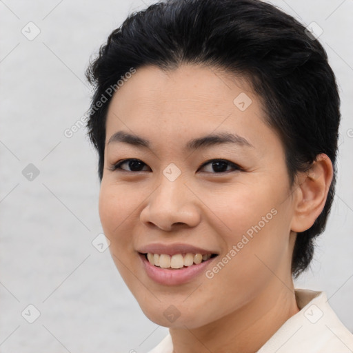 Joyful asian young-adult female with medium  brown hair and brown eyes