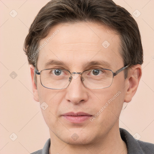 Joyful white adult male with short  brown hair and grey eyes