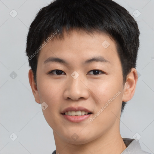 Joyful asian young-adult male with short  black hair and brown eyes