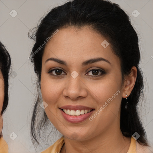 Joyful latino young-adult female with medium  brown hair and brown eyes