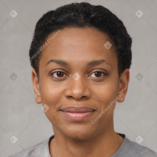 Joyful black young-adult female with short  black hair and brown eyes