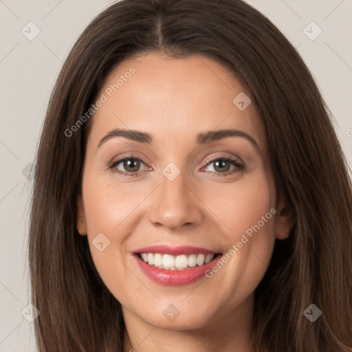 Joyful white young-adult female with long  brown hair and brown eyes