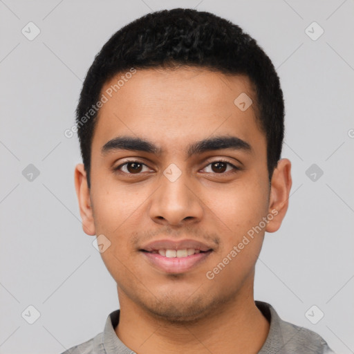 Joyful latino young-adult male with short  black hair and brown eyes