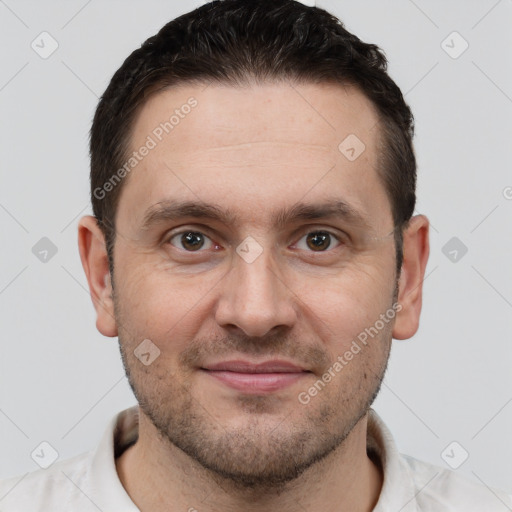 Joyful white adult male with short  brown hair and brown eyes