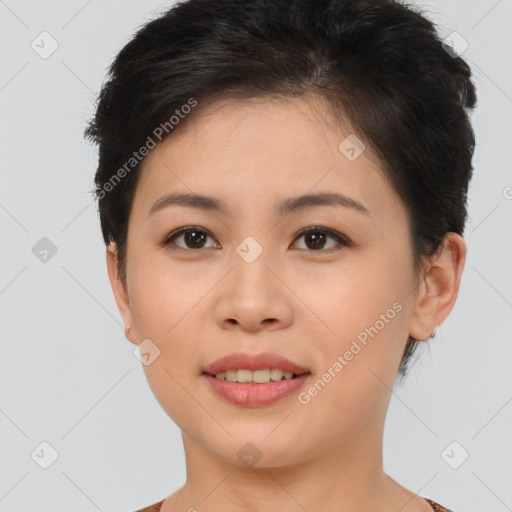 Joyful asian young-adult female with short  brown hair and brown eyes