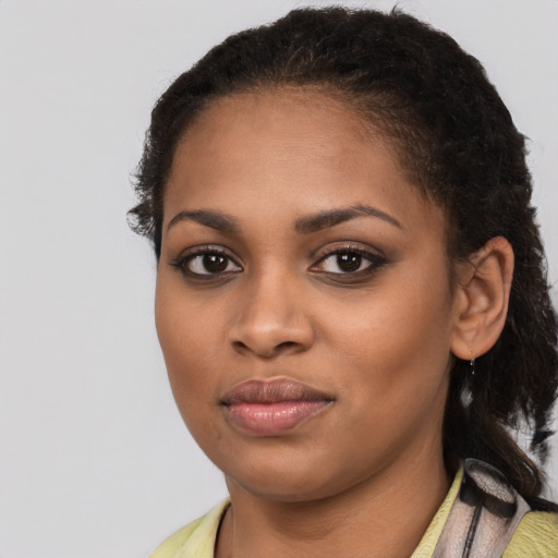 Joyful latino young-adult female with medium  brown hair and brown eyes