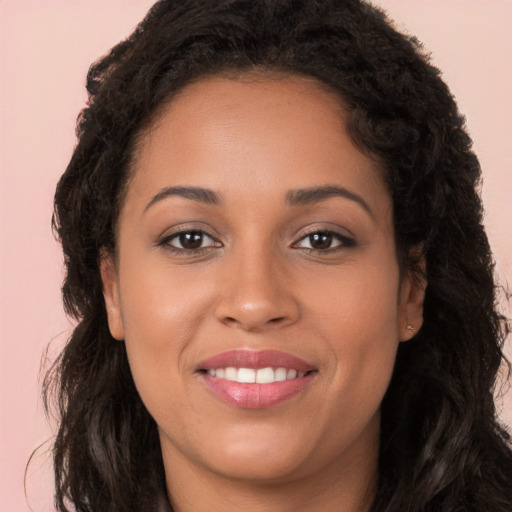 Joyful white young-adult female with long  brown hair and brown eyes