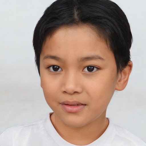 Joyful asian child female with short  brown hair and brown eyes