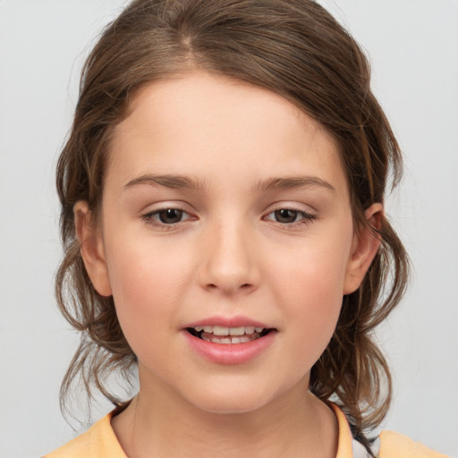 Joyful white child female with medium  brown hair and brown eyes