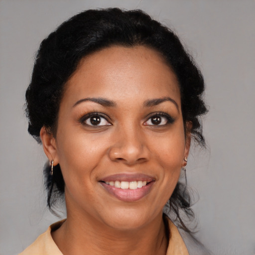Joyful black young-adult female with medium  black hair and brown eyes