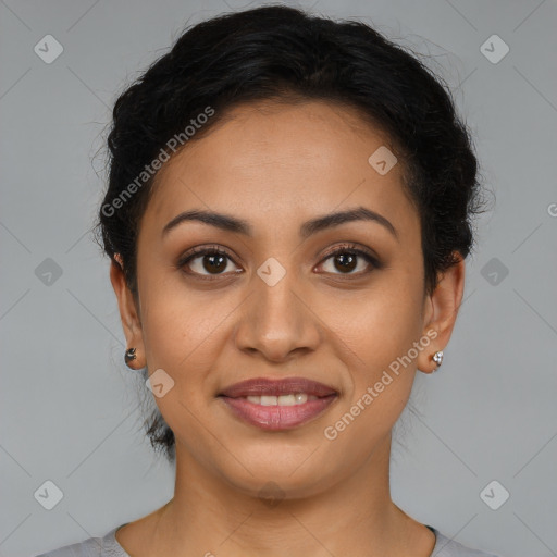 Joyful latino young-adult female with short  brown hair and brown eyes