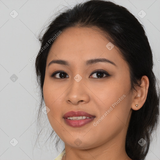 Joyful asian young-adult female with medium  brown hair and brown eyes