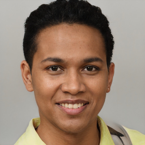 Joyful white young-adult male with short  black hair and brown eyes