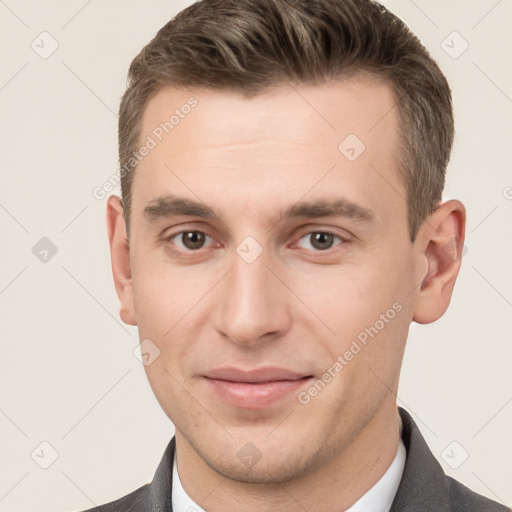 Joyful white young-adult male with short  brown hair and brown eyes