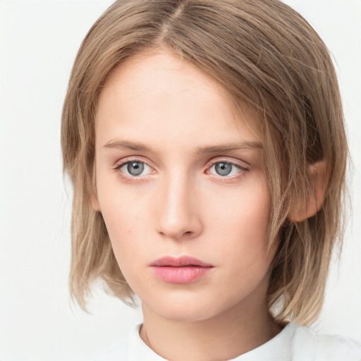 Neutral white young-adult female with medium  brown hair and grey eyes