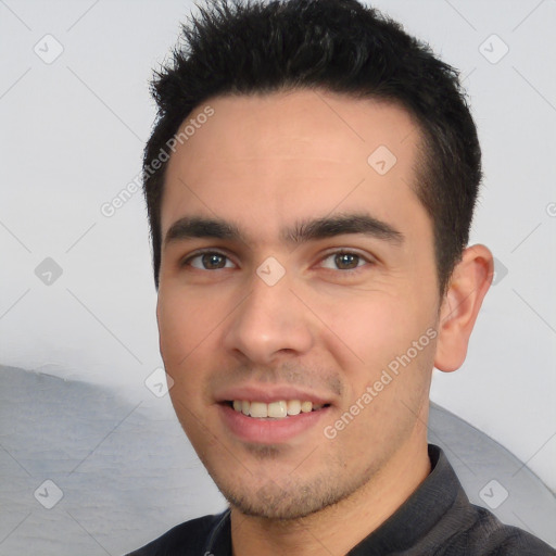 Joyful white young-adult male with short  black hair and brown eyes