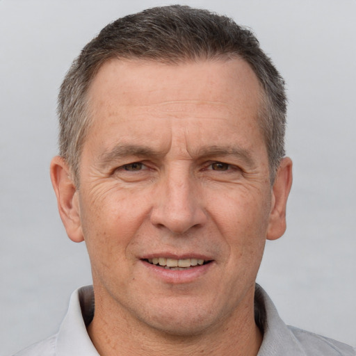 Joyful white middle-aged male with short  brown hair and brown eyes