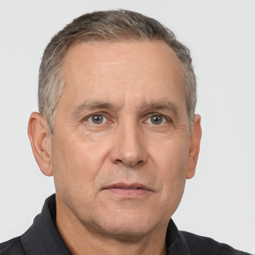 Neutral white middle-aged male with short  gray hair and brown eyes