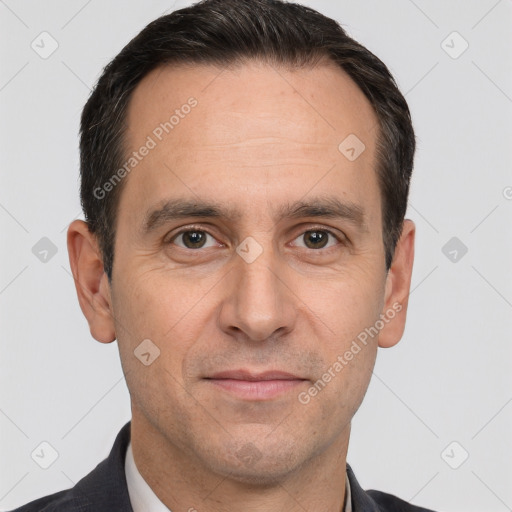 Joyful white adult male with short  brown hair and brown eyes