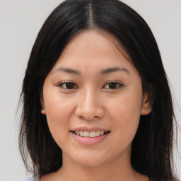 Joyful asian young-adult female with medium  brown hair and brown eyes