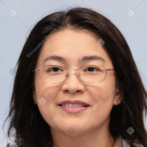 Joyful white adult female with long  brown hair and brown eyes