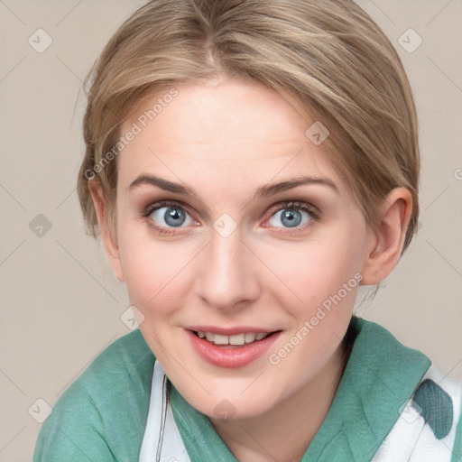 Joyful white young-adult female with medium  brown hair and blue eyes