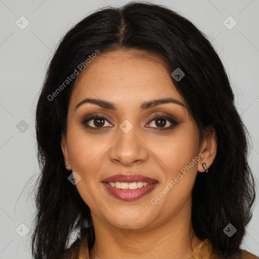 Joyful latino young-adult female with long  brown hair and brown eyes