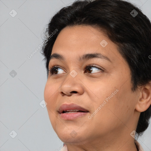 Joyful asian adult female with medium  brown hair and brown eyes