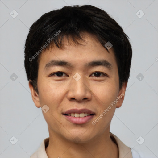 Joyful asian young-adult male with short  black hair and brown eyes