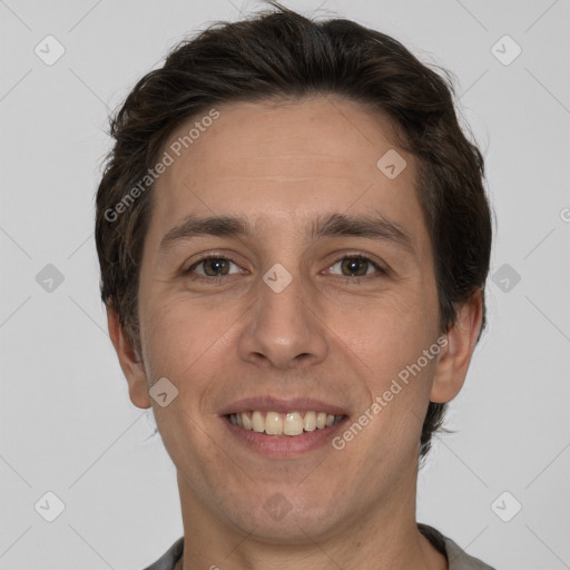 Joyful white adult male with short  brown hair and brown eyes