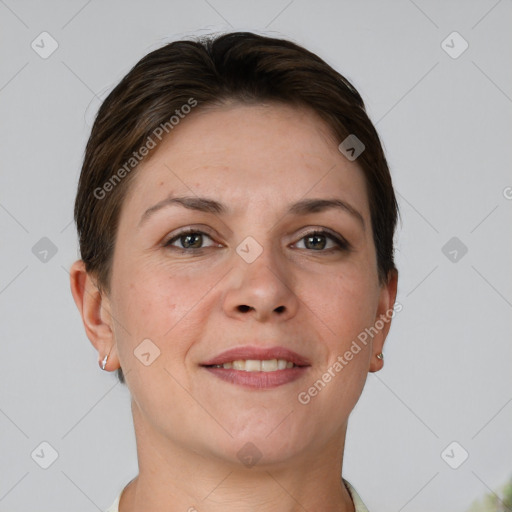 Joyful white adult female with short  brown hair and grey eyes