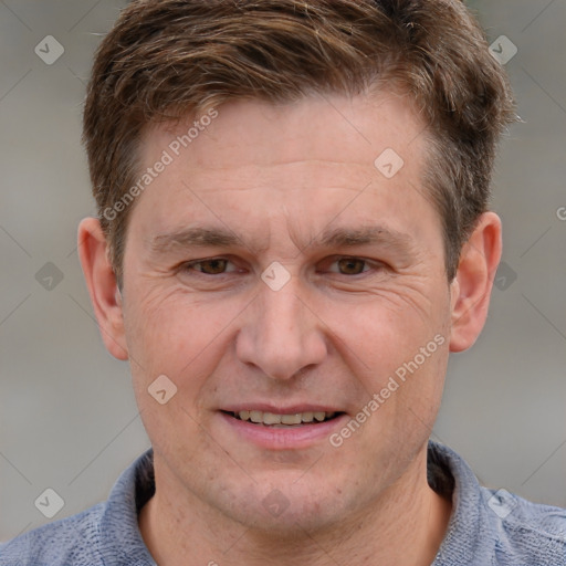 Joyful white adult male with short  brown hair and grey eyes