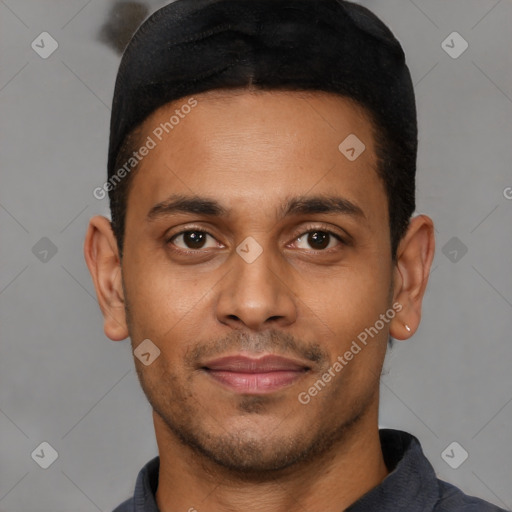 Joyful latino young-adult male with short  brown hair and brown eyes