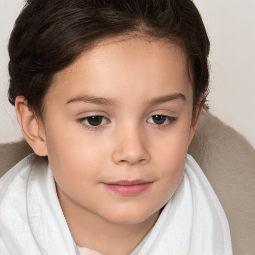 Joyful white child female with short  brown hair and brown eyes