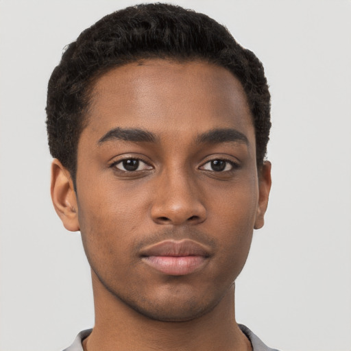 Neutral black young-adult male with short  brown hair and brown eyes