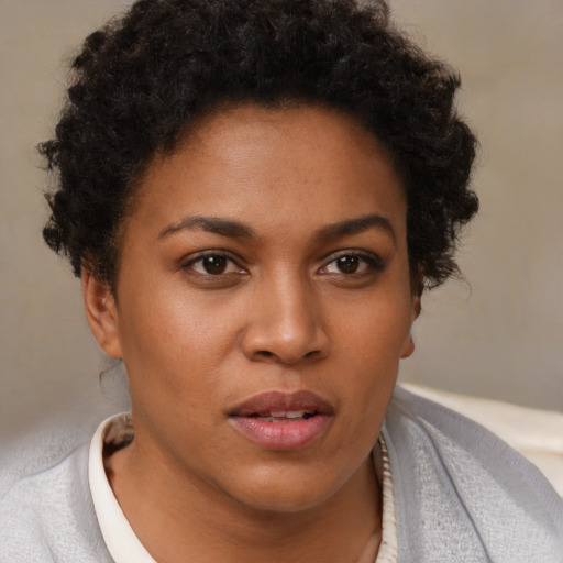 Neutral black young-adult female with short  brown hair and brown eyes