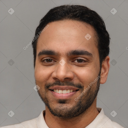 Joyful latino young-adult male with short  black hair and brown eyes