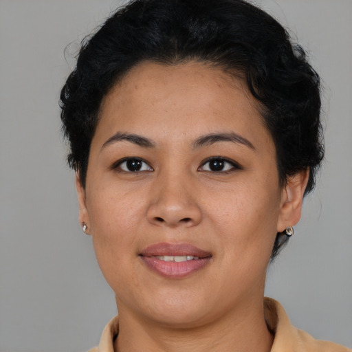 Joyful asian young-adult female with short  brown hair and brown eyes