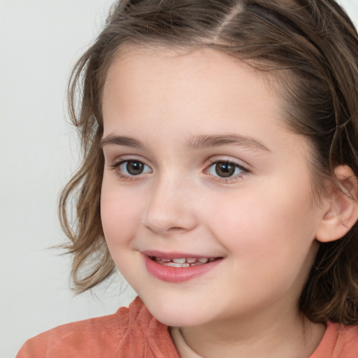 Joyful white child female with medium  brown hair and brown eyes