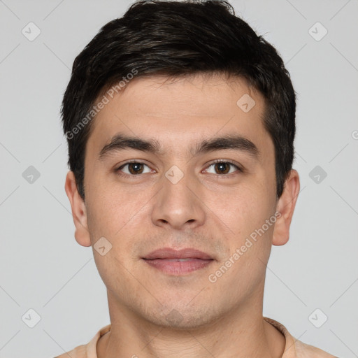 Joyful white young-adult male with short  black hair and brown eyes