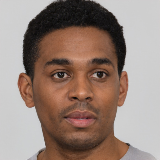 Neutral black young-adult male with short  brown hair and brown eyes