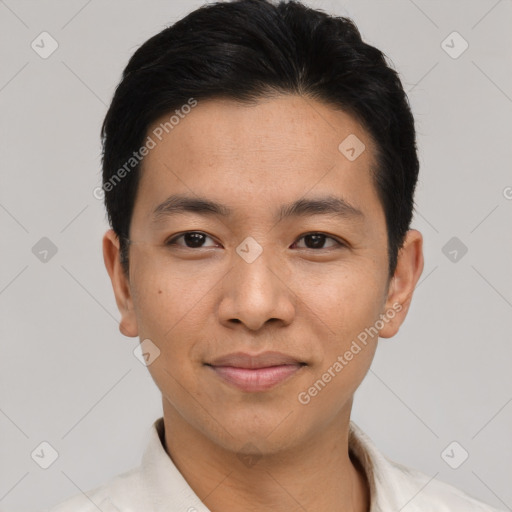 Joyful asian young-adult male with short  black hair and brown eyes