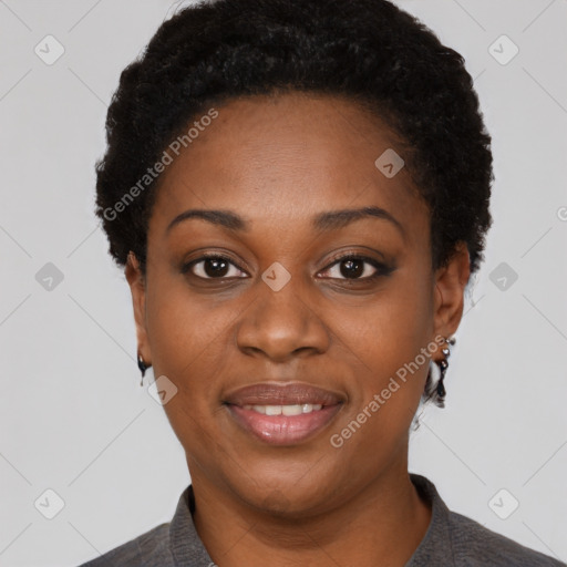 Joyful black young-adult female with short  black hair and brown eyes