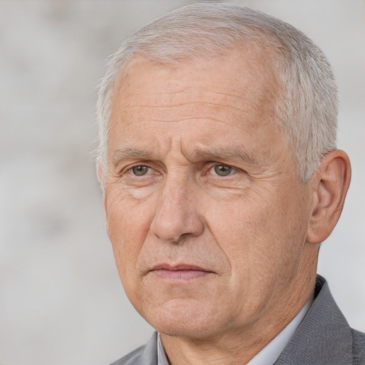 Neutral white middle-aged male with short  gray hair and brown eyes