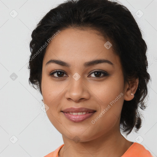 Joyful latino young-adult female with medium  brown hair and brown eyes