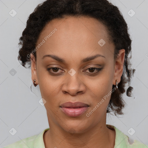 Joyful black adult female with short  brown hair and brown eyes