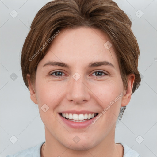 Joyful white young-adult female with short  brown hair and grey eyes