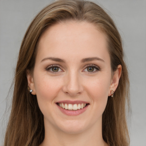 Joyful white young-adult female with long  brown hair and grey eyes