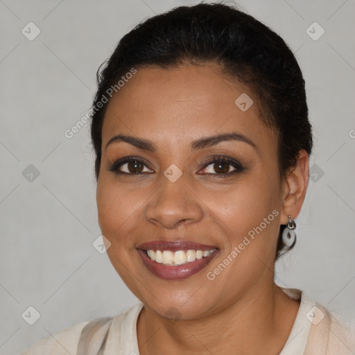 Joyful latino young-adult female with short  brown hair and brown eyes